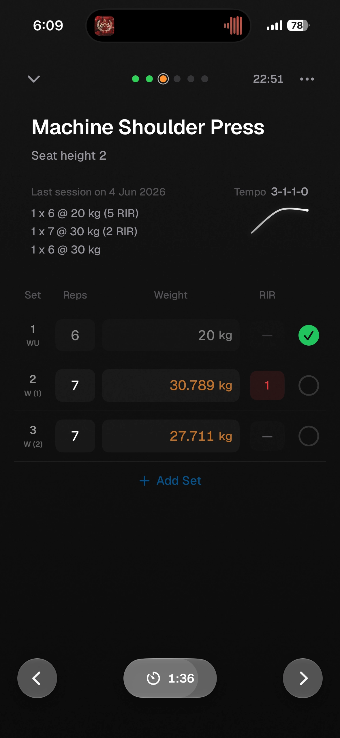 Kiron set logging on iPhone: machine shoulder press with last session's sets and RIR shown above the rows being logged, a rest timer running below.